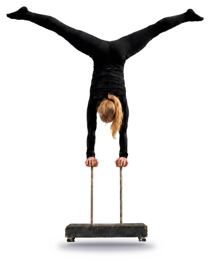 Henriette holding a split handstand on canes